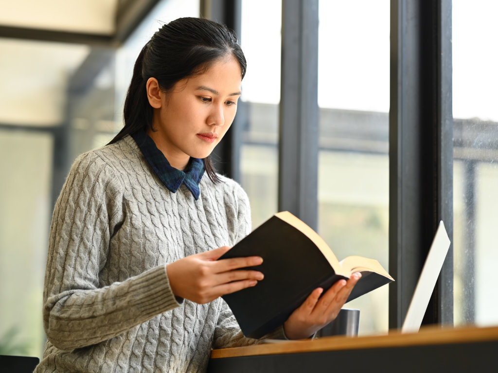 Asian lady reading